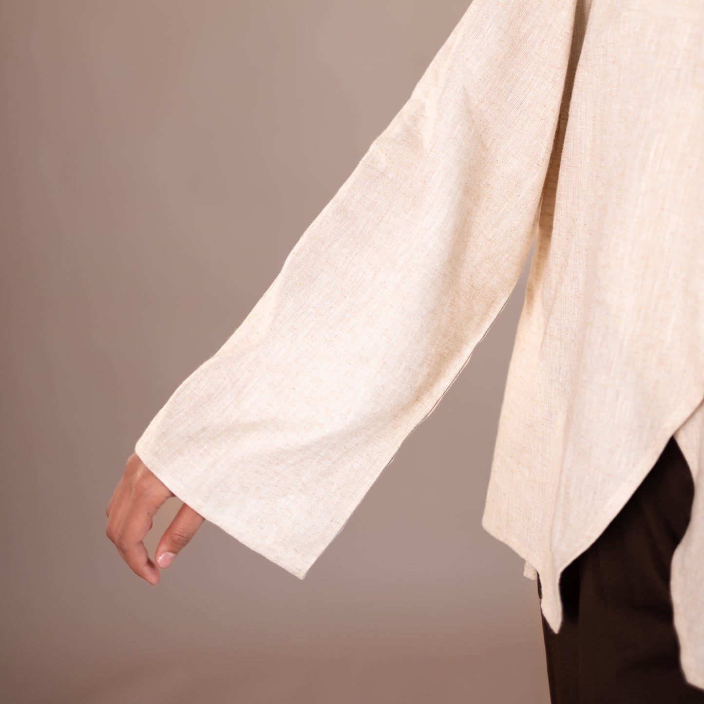 Close-up of a beige garment with a plain background