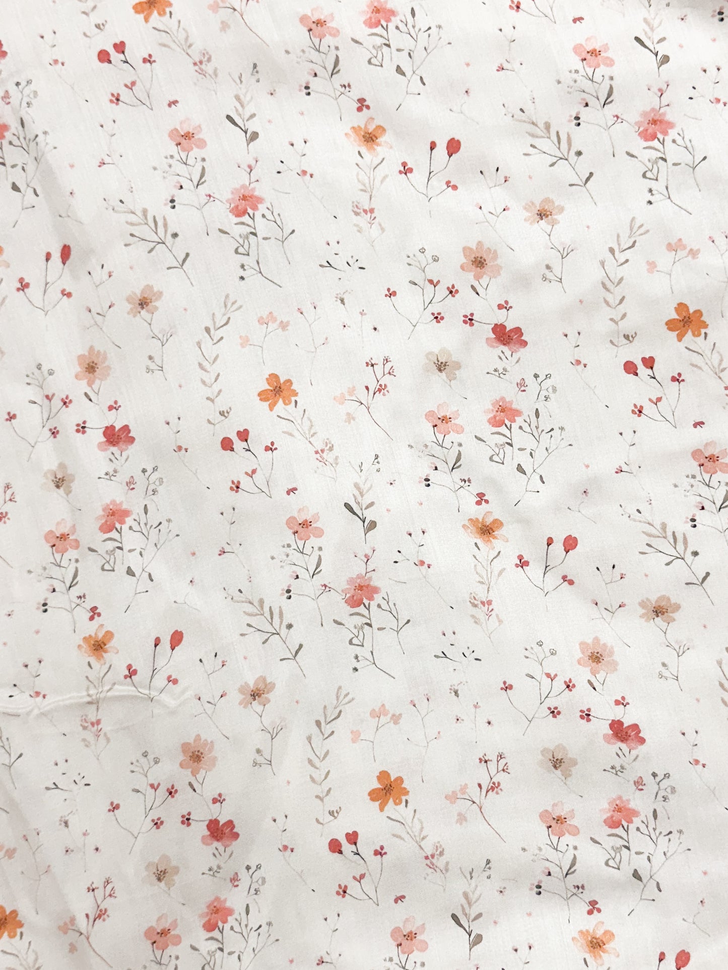 Floral pattern with small flowers and leaves on a white background