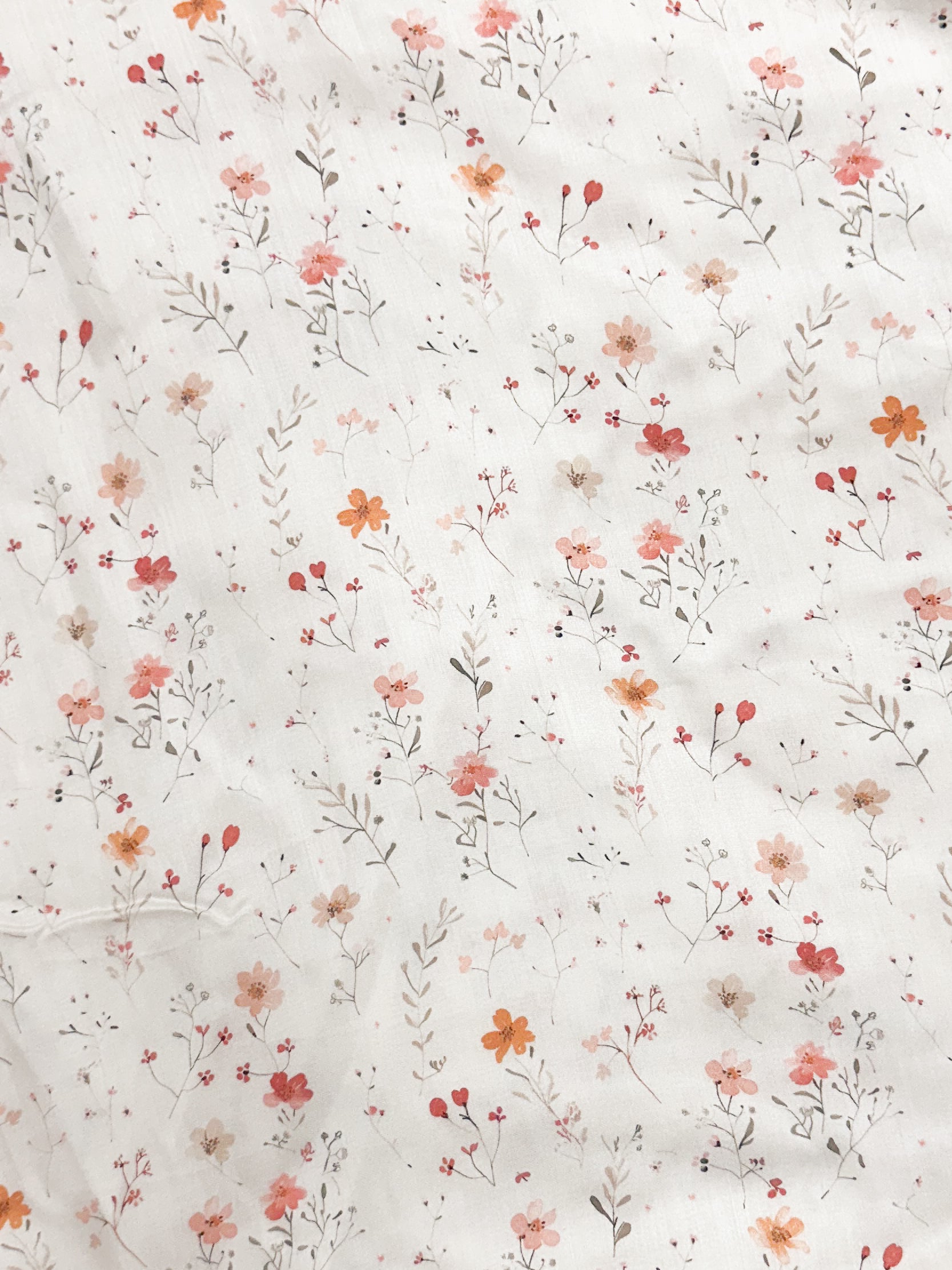 Floral pattern with small flowers and leaves on a white background