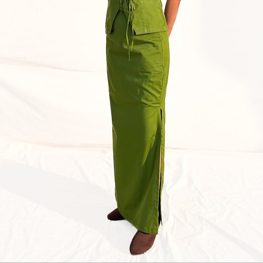 Woman wearing a green dress on a white background