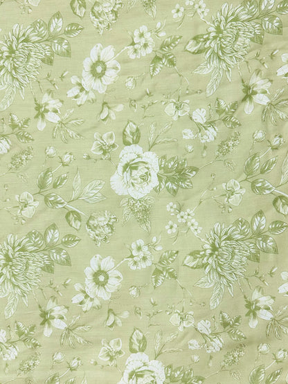 Floral pattern with white flowers and green leaves on a light green background
